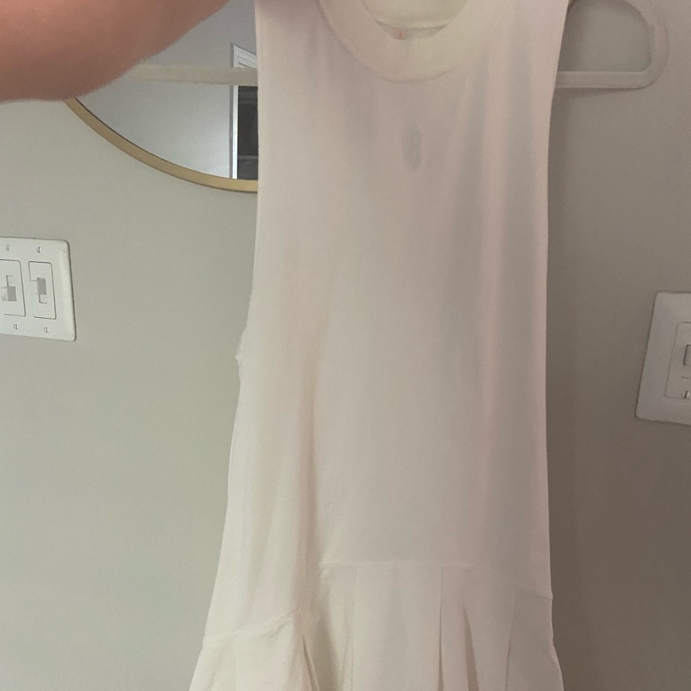Free people athletic dress, never worn, small zipper pocket on the back